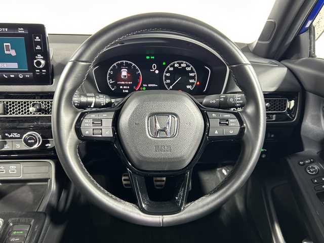 ホンダ シビック LX 神奈川県 2021(令3)年 3万km プレミアムクリスタルブルークリスタル ホンダコネクナビトディスプレイ【MY21ADA】/ナビゲーションシステム/フルセグ　Bluetooth USB　AM　FM　WI-FI/ホンダセンシング/衝突軽減ブレーキ/誤発進抑制機能/後方誤発進抑制機能/近距離衝突軽減ブレーキ/歩行者事故低減ステアリング/路外逸脱抑制機能/渋滞追従機能付アダブティブクルーズコントロール/車線維持支援システム/トラフィックジャムアシスト/先行車発進お知らせ機能/標識認識機能/オートハイビーム/パーキングセンサーシステム/ブラインドスポットインフォメーション/後退出庫サポート/プライムスムース合皮/ファブリックコンビシート/前席シートヒーター/革巻きステアリング/SOSコール/純正ビルトインETC2.0/自動防眩ミラー/社外前方ドライブレコーダー/プッシュスタート/スマートキー/純正サイド/リアスポイラー/純正18インチアルミホイール/無限ドアバイザー/LEDヘッドライト/オートライト/フロントフォグランプ