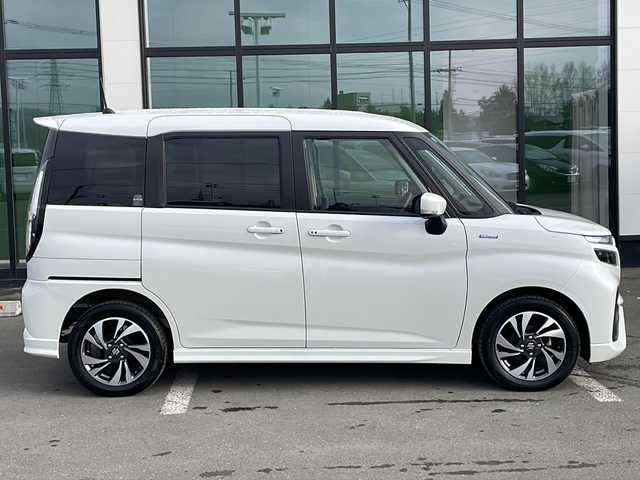 スズキ ソリオ バンディット HV MV 道東・釧路十勝 2024(令6)年 1.5万km ピュアホワイトP ・４WD/・社外SDナビ/（BT・ラジオ）/・バックカメラ/・両側パワースライドドア/・レーダークルーズコントロール/・スズキセーフティサポート/・ドライブレコーダー/・アイドリングストップ/・前席シートヒーター/・横滑り防止装置/・前後コーナーセンサー/・LEDヘッドライト/・レーンキープアシスト/・衝突被害軽減ブレーキ/・保証書/・取扱説明書