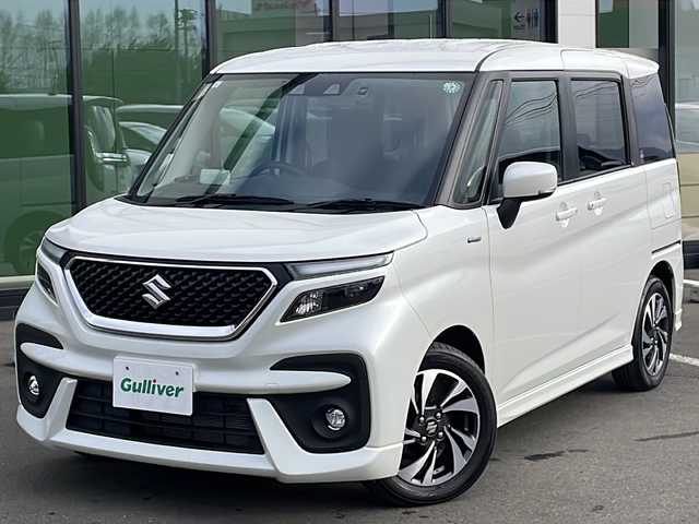 スズキ ソリオ バンディット HV MV 道東・釧路十勝 2024(令6)年 1.5万km ピュアホワイトP ・４WD/・社外SDナビ/（BT・ラジオ）/・バックカメラ/・両側パワースライドドア/・レーダークルーズコントロール/・スズキセーフティサポート/・ドライブレコーダー/・アイドリングストップ/・前席シートヒーター/・横滑り防止装置/・前後コーナーセンサー/・LEDヘッドライト/・レーンキープアシスト/・衝突被害軽減ブレーキ/・保証書/・取扱説明書