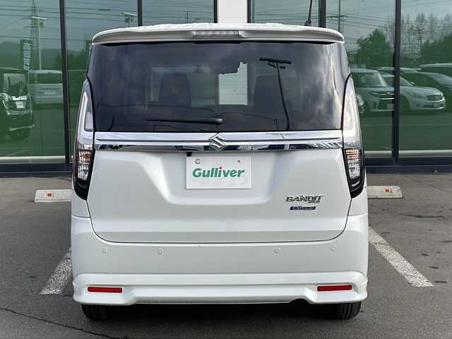 スズキ ソリオ バンディット HV MV 道東・釧路十勝 2024(令6)年 1.5万km ピュアホワイトP ・４WD/・社外SDナビ/（BT・ラジオ）/・バックカメラ/・両側パワースライドドア/・レーダークルーズコントロール/・スズキセーフティサポート/・ドライブレコーダー/・アイドリングストップ/・前席シートヒーター/・横滑り防止装置/・前後コーナーセンサー/・LEDヘッドライト/・レーンキープアシスト/・衝突被害軽減ブレーキ/・保証書/・取扱説明書