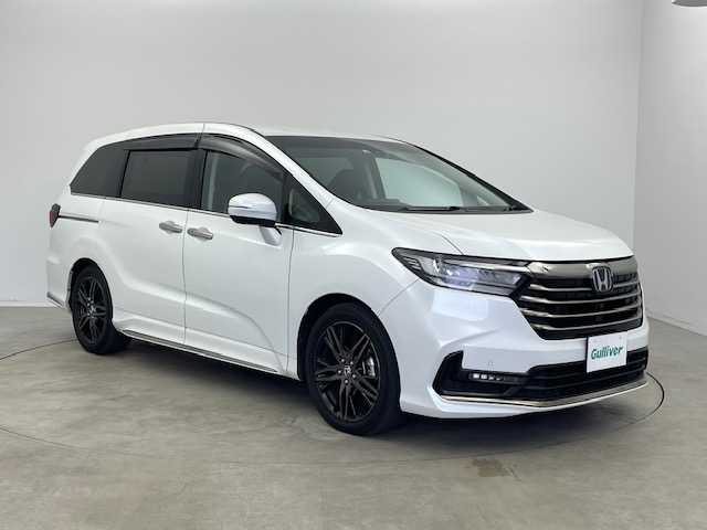 ホンダ オデッセイ ハイブリッド e:HEVアブソルート EX 宮崎県 2022(令4)年 5.4万km プラチナホワイトパール 〇10インチプレミアムインターナビ/〇フルセグTV/〇ジェスチャーコントロールパワースライドドア(両側)/〇全方位モニター/〇ETC2.0/〇ドライブレコーダー/〇オプション本革シート/〇ホンダセンシング/〇衝突軽減ブレーキ/〇アダプティブクルーズコントロール/〇車線維持支援システム/〇スマートパーキングアシストシステム/〇パーキングセンサーシステム/〇ブラインドスポットインフォメイション/〇ハンズフリーアクセスパワーバックドア/〇LEDヘッドランプ/〇プラズマクラスター付左右独立温度調整オートエアコン/〇リアオートエアコン/〇運転席大型アームレスト/〇パワーシート/〇シートヒーター/〇２列目左右アームレスト付キャプテンシート/〇スマートキーシステム/〇SRSエアバック（運転席・助手席・サイド・カーテン）