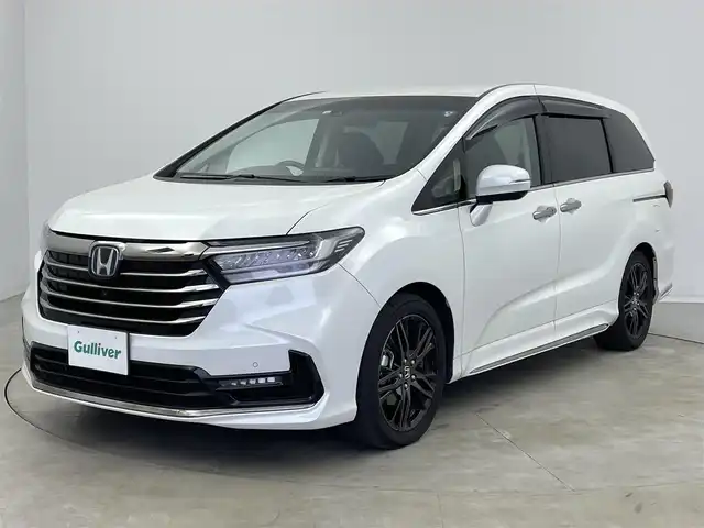 ホンダ オデッセイ ハイブリッド e:HEVアブソルート EX 宮崎県 2022(令4)年 5.4万km プラチナホワイトパール 〇10インチプレミアムインターナビ/〇フルセグTV/〇ジェスチャーコントロールパワースライドドア(両側)/〇全方位モニター/〇ETC2.0/〇ドライブレコーダー/〇オプション本革シート/〇ホンダセンシング/〇衝突軽減ブレーキ/〇アダプティブクルーズコントロール/〇車線維持支援システム/〇スマートパーキングアシストシステム/〇パーキングセンサーシステム/〇ブラインドスポットインフォメイション/〇ハンズフリーアクセスパワーバックドア/〇LEDヘッドランプ/〇プラズマクラスター付左右独立温度調整オートエアコン/〇リアオートエアコン/〇運転席大型アームレスト/〇パワーシート/〇シートヒーター/〇２列目左右アームレスト付キャプテンシート/〇スマートキーシステム/〇SRSエアバック（運転席・助手席・サイド・カーテン）