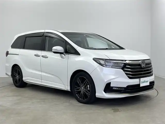 ホンダ オデッセイ ハイブリッド e:HEVアブソルート EX 宮崎県 2022(令4)年 5.4万km プラチナホワイトパール 〇10インチプレミアムインターナビ/〇フルセグTV/〇ジェスチャーコントロールパワースライドドア(両側)/〇全方位モニター/〇ETC2.0/〇ドライブレコーダー/〇オプション本革シート/〇ホンダセンシング/〇衝突軽減ブレーキ/〇アダプティブクルーズコントロール/〇車線維持支援システム/〇スマートパーキングアシストシステム/〇パーキングセンサーシステム/〇ブラインドスポットインフォメイション/〇ハンズフリーアクセスパワーバックドア/〇LEDヘッドランプ/〇プラズマクラスター付左右独立温度調整オートエアコン/〇リアオートエアコン/〇運転席大型アームレスト/〇パワーシート/〇シートヒーター/〇２列目左右アームレスト付キャプテンシート/〇スマートキーシステム/〇SRSエアバック（運転席・助手席・サイド・カーテン）