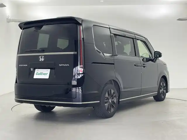ホンダ ステップワゴン スパーダ 福井県 2024(令6)年 0.6万km クリスタルブラックパール 9型純正ナビ　/【AM/FM/CD/DVD/Bluetooth/フルセグ】/ホンダセンシング/-車線逸脱警報/-レーンキープアシスト/-BSM/-踏み間違い防止/-オートクルーズコントロール/全方位カメラ/両側パワースライドドア　/パワーバックドア　/ハーフレザーシート　/シートヒーター　/LEDライト/ETC/ドライブレコーダー前後