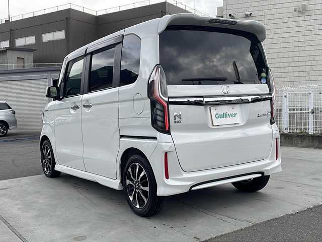 ホンダ Ｎ ＢＯＸ カスタム G L ホンダセンシング 山梨県 2020(令2)年 4.2万km プラチナホワイトパール 純正8インチナビ/バックカメラ/衝突被害軽減システム/車線逸脱警報/追従式クルーズコントロール/両側パワースライドドア/横滑り防止装置/ビルトインETC/アイドリングストップ/LEDヘッドライト/オートライト/純正18インチAW/シートヒーター/フルセグTV/フルオートエアコン/プッシュスタート/スマートキー/純正フロアマット取扱説明書/保証書