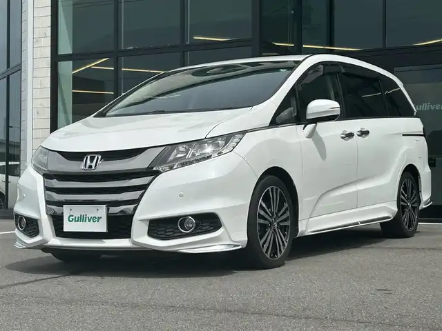 ホンダ オデッセイ アブソルート・EXホンダセンジング 愛媛県 2017(平29)年 5.3万km ホワイトオーキッドパール 純正8型ナビ/バックカメラ/両側電動スライド/ブラインドスポットモニター/アダプティブクルーズコントロール/パドルシフト/半革電動シート/クリアランスソナー/LEDヘッドライト/後付け大型アームレスト/ドアバイザー/シガーソケット/ステアリングリモコン/電格ミラー/ヒートミラー/現状サマー(純正AW)(225/45/R18)/Continental ContiMAXContactMC5