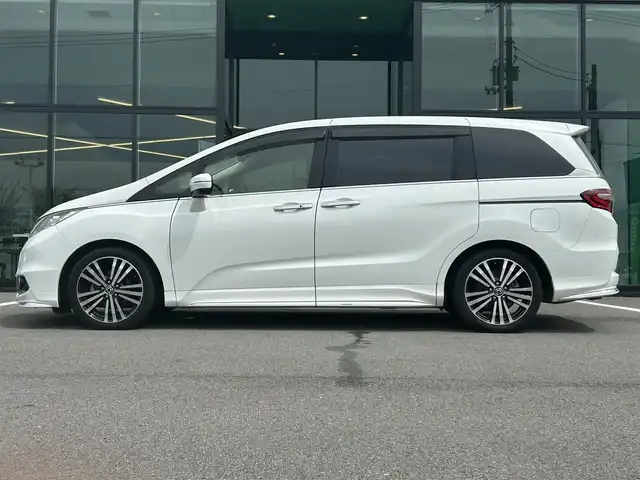 ホンダ オデッセイ アブソルート・EXホンダセンジング 愛媛県 2017(平29)年 5.3万km ホワイトオーキッドパール 純正8型ナビ/バックカメラ/両側電動スライド/ブラインドスポットモニター/アダプティブクルーズコントロール/パドルシフト/半革電動シート/クリアランスソナー/LEDヘッドライト/後付け大型アームレスト/ドアバイザー/シガーソケット/ステアリングリモコン/電格ミラー/ヒートミラー/現状サマー(純正AW)(225/45/R18)/Continental ContiMAXContactMC5