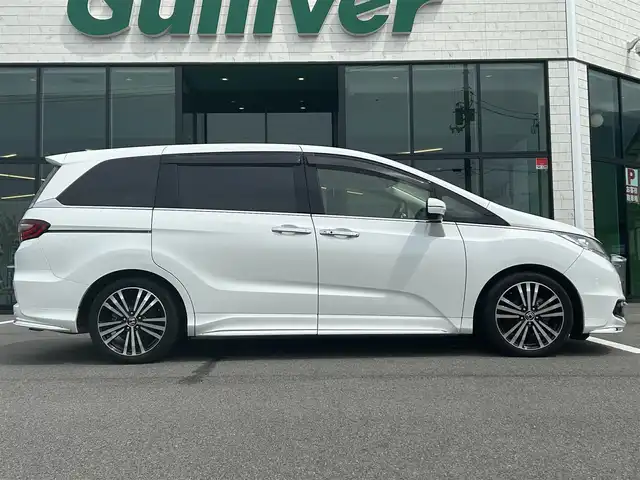 ホンダ オデッセイ アブソルート・EXホンダセンジング 愛媛県 2017(平29)年 5.3万km ホワイトオーキッドパール 純正8型ナビ/バックカメラ/両側電動スライド/ブラインドスポットモニター/アダプティブクルーズコントロール/パドルシフト/半革電動シート/クリアランスソナー/LEDヘッドライト/後付け大型アームレスト/ドアバイザー/シガーソケット/ステアリングリモコン/電格ミラー/ヒートミラー/現状サマー(純正AW)(225/45/R18)/Continental ContiMAXContactMC5