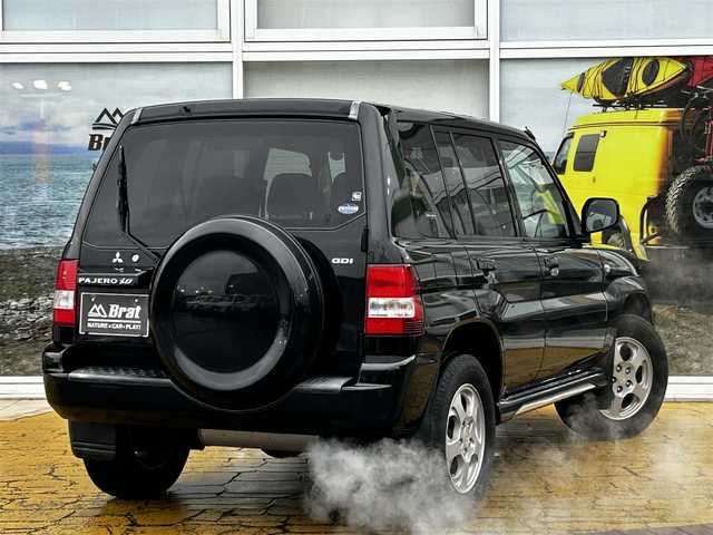 三菱 パジェロ イオ パールパッケージ ナビED 道北・旭川 2002(平14)年 3.7万km ピレネーブラック 走行距離36700キロ/運転席助手席エアバック/純正アルミホイール/電動格納ドアミラー/オートエアコン/ABS/背面タイヤ/社外ドライブレコーダー