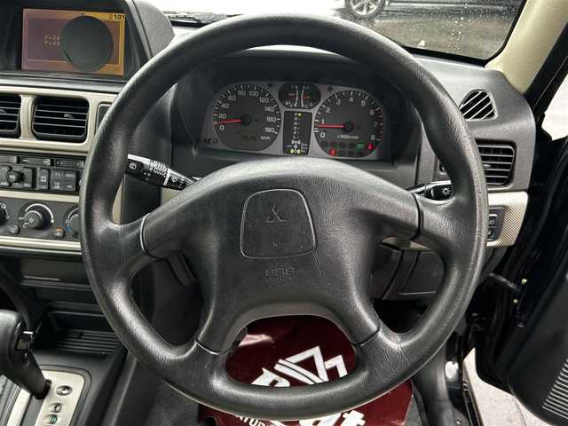 三菱 パジェロ イオ パールパッケージ ナビED 道北・旭川 2002(平14)年 3.7万km ピレネーブラック 走行距離36700キロ/運転席助手席エアバック/純正アルミホイール/電動格納ドアミラー/オートエアコン/ABS/背面タイヤ/社外ドライブレコーダー