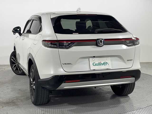 ホンダ ヴェゼル ハイブリッド e:HEV Z 広島県 2021(令3)年 4.8万km プラチナホワイトパール 純正９型ナビ/バックカメラ/シートヒーター/電動リアゲート/ワイヤレス充電/ブラインドスポットモニター/ＥＴＣ２．０/前後ドラレコ/オートハイビーム/ステアリングヒーター/レーダークルーズコントロール/衝突軽減/レーンキープアシスト/踏み間違い防止/純正18インチアルミホイール(225/50/R18)/エアバッグ(運転席/助手席/サイド/カーテン)
