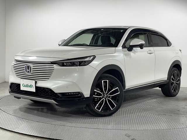 ホンダ ヴェゼル ハイブリッド e:HEV Z 広島県 2021(令3)年 4.8万km プラチナホワイトパール 純正９型ナビ/バックカメラ/シートヒーター/電動リアゲート/ワイヤレス充電/ブラインドスポットモニター/ＥＴＣ２．０/前後ドラレコ/オートハイビーム/ステアリングヒーター/レーダークルーズコントロール/衝突軽減/レーンキープアシスト/踏み間違い防止/純正18インチアルミホイール(225/50/R18)/エアバッグ(運転席/助手席/サイド/カーテン)