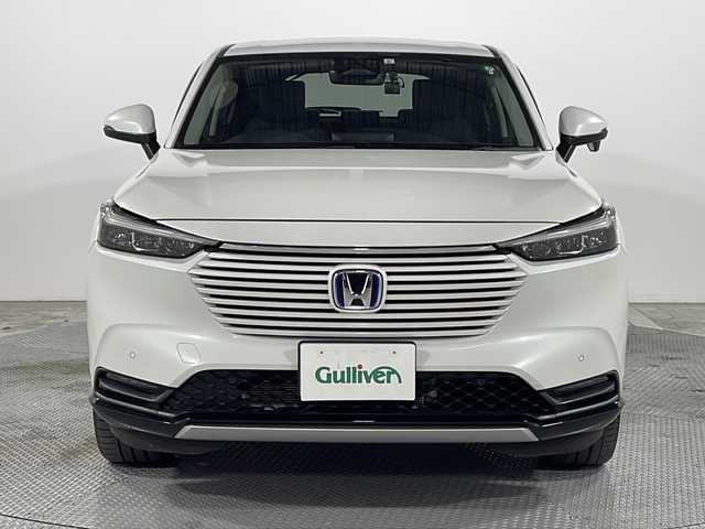 ホンダ ヴェゼル ハイブリッド e:HEV Z 広島県 2021(令3)年 4.8万km プラチナホワイトパール 純正９型ナビ/バックカメラ/シートヒーター/電動リアゲート/ワイヤレス充電/ブラインドスポットモニター/ＥＴＣ２．０/前後ドラレコ/オートハイビーム/ステアリングヒーター/レーダークルーズコントロール/衝突軽減/レーンキープアシスト/踏み間違い防止/純正18インチアルミホイール(225/50/R18)/エアバッグ(運転席/助手席/サイド/カーテン)