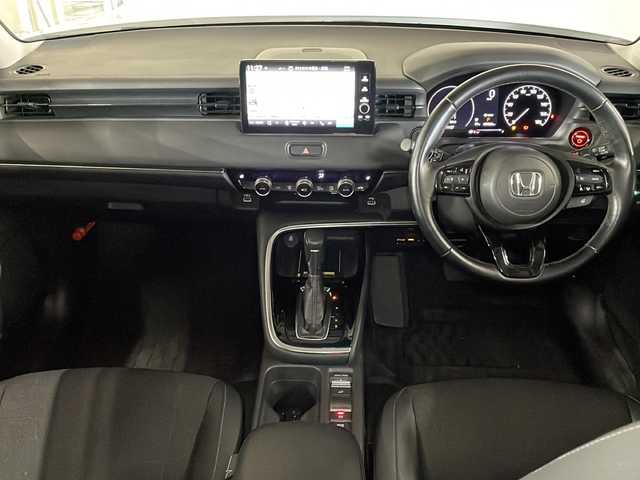 ホンダ ヴェゼル ハイブリッド e:HEV Z 広島県 2021(令3)年 4.8万km プラチナホワイトパール 純正９型ナビ/バックカメラ/シートヒーター/電動リアゲート/ワイヤレス充電/ブラインドスポットモニター/ＥＴＣ２．０/前後ドラレコ/オートハイビーム/ステアリングヒーター/レーダークルーズコントロール/衝突軽減/レーンキープアシスト/踏み間違い防止/純正18インチアルミホイール(225/50/R18)/エアバッグ(運転席/助手席/サイド/カーテン)