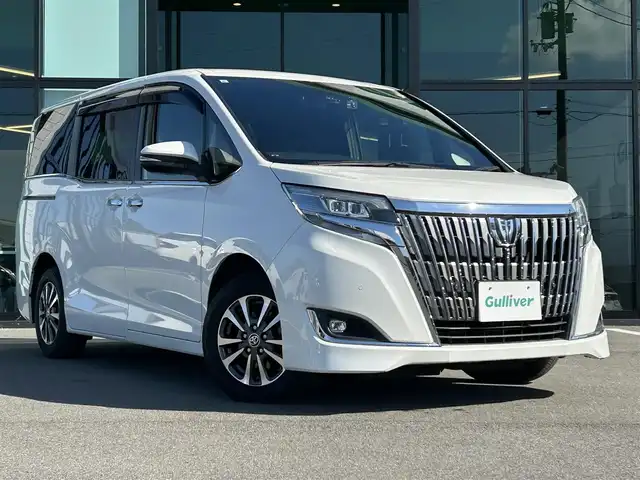 トヨタ エスクァイア Gi 愛媛県 2019(令1)年 7.5万km ホワイトパールクリスタルシャイン 純正9型ナビ(Bluetooth/フルセグTV)/純正12.1型後席モニター/両側パワースライドドア/トヨタセーフティセンス/クルーズコントロール/クリアランスソナー/衝突被害軽減装置/車線逸脱防止装置/LEDヘッドライト/オートライト/オートマチックハイビーム/ブラック合皮シート／シートヒーター/前後ドライブレコーダー/アイドリングストップ/後席サンシェイド/純正フロアマット/純正ドアバイザー/電格ミラー/現状サマー(純正AW)(195/65/R15)/YOKOHAMA BluEarth-ES ES32/禁煙車