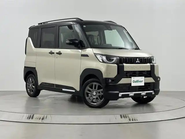 三菱 デリカミニ T プレミアム 埼玉県 2025(令7)年 0.1万km未満 アイボリーⅡ 9型純正ディスプレイオーディオ（BT/AM/FM）/アラウンドビューモニター/レーダークルーズコントロール/横滑り防止装置/盗難防止装置/レーンキープアシスト/車線逸脱防止システム/先行車お知らせ機能/オートライト/LEDヘッドライト/コーナーセンサー/ステアリングヒーター/シートヒーター/スマートキー