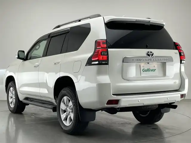 トヨタ ランドクルーザー プラド TX Lパッケージ 愛知県 2022(令4)年 0.9万km ホワイトパールクリスタルシャイン メーカーナビ　ムーンルーフ　ベージュ革シート　全方位カメラ　シートヒーター　前後ドラレコ　ＢＳＭ　ＥＴＣ２．０　セーフティセンス　衝突軽減　追従クルコン　コーナーセンサー　ＬＥＤオートライト　フォグ　TVキャンセラー　スペアタイヤ　純正フロアマット　ドアバイザー　ルーフレール　純正フロアマット
