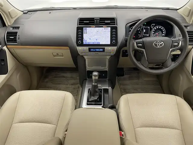 トヨタ ランドクルーザー プラド TX Lパッケージ 愛知県 2022(令4)年 0.9万km ホワイトパールクリスタルシャイン メーカーナビ　ムーンルーフ　ベージュ革シート　全方位カメラ　シートヒーター　前後ドラレコ　ＢＳＭ　ＥＴＣ２．０　セーフティセンス　衝突軽減　追従クルコン　コーナーセンサー　ＬＥＤオートライト　フォグ　TVキャンセラー　スペアタイヤ　純正フロアマット　ドアバイザー　ルーフレール　純正フロアマット