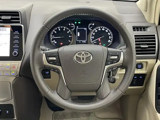 トヨタ ランドクルーザー プラド TX Lパッケージ 愛知県 2022(令4)年 0.9万km ホワイトパールクリスタルシャイン メーカーナビ　ムーンルーフ　ベージュ革シート　全方位カメラ　シートヒーター　前後ドラレコ　ＢＳＭ　ＥＴＣ２．０　セーフティセンス　衝突軽減　追従クルコン　コーナーセンサー　ＬＥＤオートライト　フォグ　TVキャンセラー　スペアタイヤ　純正フロアマット　ドアバイザー　ルーフレール　純正フロアマット