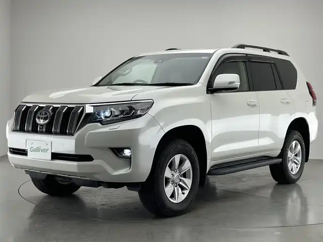 トヨタ ランドクルーザー プラド TX Lパッケージ 愛知県 2022(令4)年 0.9万km ホワイトパールクリスタルシャイン メーカーナビ　ムーンルーフ　ベージュ革シート　全方位カメラ　シートヒーター　前後ドラレコ　ＢＳＭ　ＥＴＣ２．０　セーフティセンス　衝突軽減　追従クルコン　コーナーセンサー　ＬＥＤオートライト　フォグ　TVキャンセラー　スペアタイヤ　純正フロアマット　ドアバイザー　ルーフレール　純正フロアマット
