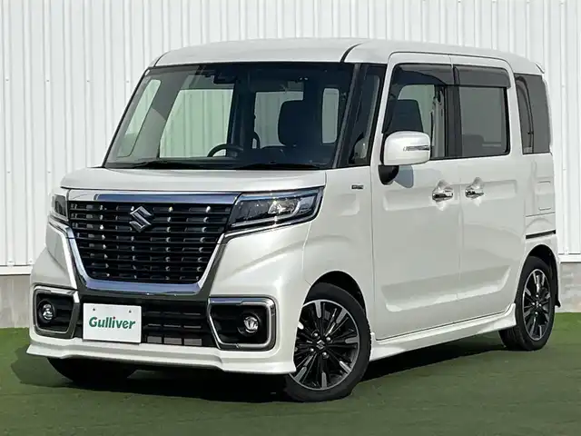 スズキ スペーシア カスタム HYBRID XS ターボ 香川県 2019(令1)年 5.6万km ピュアホワイトP 登録時走行距離：55501km/カロッツェリアナビ/　CD DVD BT　フルセグTV/バックカメラ/両側パワースライドドア/衝突被害軽減装置/レーンキープアシスト/クルーズコントロール/クリアランスソナー/横滑り防止装置/アイドリングストップ/ETC/ドライブレコーダー/ハーフレザーシート/シートヒーター/サンシェード/サーキュレータ/革巻きステアリング/スラアリングリモコン/パドルシフト/プッシュスタート/スマートキー