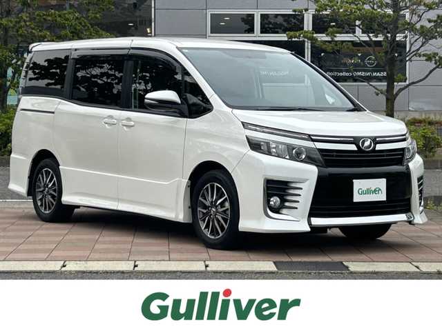 トヨタ ヴォクシー ZS 福島県 2014(平26)年 7.1万km ホワイトパールクリスタルシャイン 純正ナビゲーション/型番：NSZT-Y62G/【CD/DVD/SD/BT/TV】/バックカメラ/フリップダウンモニター/ビルトインETC/両側パワースライドドア/LEDオートライト/プッシュスタート/シートカバー/リアドアシェード/純正フロアマット/純正ドアバイザー