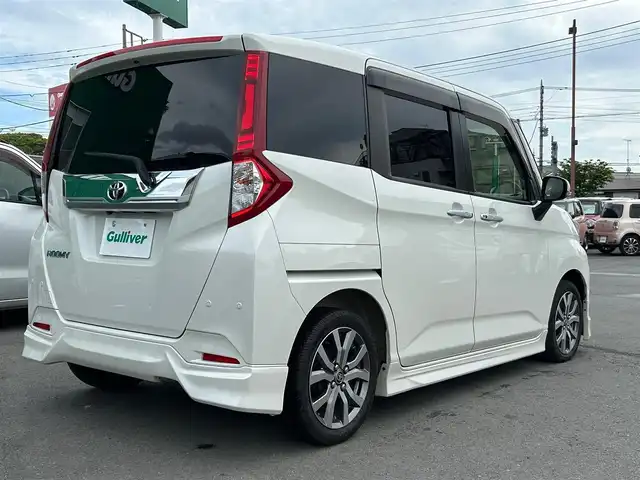 トヨタ ルーミー カスタムG－T 静岡県 2019(令1)年 4.4万km パール エンジンスタートボタン/パワーステアリング/パワーウィンドウ/アイドリングストップ/スマートキー/オートエアコン/クルーズコントロール/SDナビ（CD.DVD)/Bluetooth/SDミュージックサーバー/TV（フルセグ）/ETC/ウォークスルー/純正フロアマット/シートヒーター/両側パワースライドドア/エアロパーツ（モデリスタ）/純正アルミホイール/ABS/横滑り防止装置/コーナーセンサー前後/レーンキープアシスト/オートライト/オートマチックハイビーム/LEDライト/Wエアバッグ/衝突軽減システム
