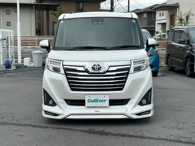 トヨタ ルーミー カスタムG－T 静岡県 2019(令1)年 4.4万km パール エンジンスタートボタン/パワーステアリング/パワーウィンドウ/アイドリングストップ/スマートキー/オートエアコン/クルーズコントロール/SDナビ（CD.DVD)/Bluetooth/SDミュージックサーバー/TV（フルセグ）/ETC/ウォークスルー/純正フロアマット/シートヒーター/両側パワースライドドア/エアロパーツ（モデリスタ）/純正アルミホイール/ABS/横滑り防止装置/コーナーセンサー前後/レーンキープアシスト/オートライト/オートマチックハイビーム/LEDライト/Wエアバッグ/衝突軽減システム
