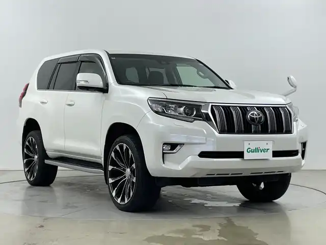 トヨタ ランドクルーザー プラド TX Lパッケージ 道央・札幌 2018(平30)年 5.3万km ホワイトパールクリスタルシャイン ・4WD/寒冷地仕様/・トヨタセーフティセンス/・プリクラッシュセーフティ/・レーダークルーズコントロール/・WALD22インチアルミ/・純正ナビ  /・フルセグTV/Bluetooth/・DVD.CD.SD/・バックカメラ/・シートヒーター/エアーシート/・LEDヘッドライト/オートハイビーム/・電動格納サードシート/・ヒッチメンバー/・冬タイヤAW積込/・センターデフロック/・ダウンヒルアシスト/・横滑り防止/・ETC2.0