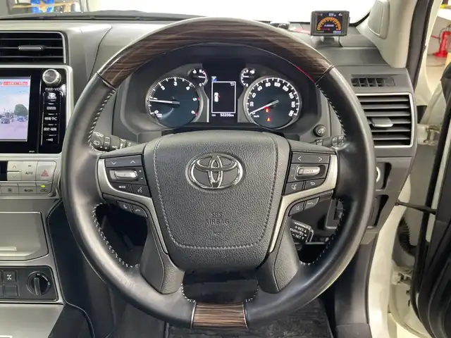 トヨタ ランドクルーザー プラド TX Lパッケージ 道央・札幌 2018(平30)年 5.3万km ホワイトパールクリスタルシャイン ・4WD/寒冷地仕様/・トヨタセーフティセンス/・プリクラッシュセーフティ/・レーダークルーズコントロール/・WALD22インチアルミ/・純正ナビ  /・フルセグTV/Bluetooth/・DVD.CD.SD/・バックカメラ/・シートヒーター/エアーシート/・LEDヘッドライト/オートハイビーム/・電動格納サードシート/・ヒッチメンバー/・冬タイヤAW積込/・センターデフロック/・ダウンヒルアシスト/・横滑り防止/・ETC2.0