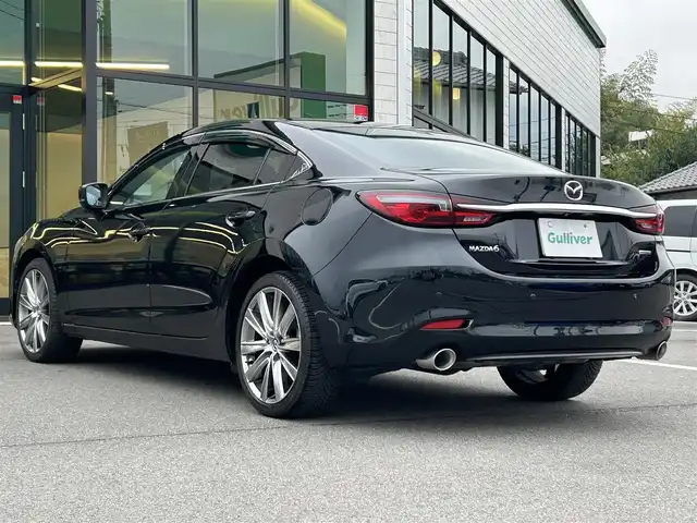 マツダ マツダ６セダン 25S Lパッケージ 愛媛県 2020(令2)年 3.5万km ジェットブラックマイカ 純正8型ナビ/全周囲カメラ/BOSEサウンドシステム＋11スピーカー/茶色レザーシート/全席シートヒーター/前席シートベンチレーション/前席パワーシート/運転席シートメモリー機能/ブラインドスポットモニター/追従機能付クルーズコントロール/ドライバーアテンションアラート/ヒル・ローンチ・アシスト/車線逸脱警報システム/AT誤発進抑制制御(前進/後退)/自動防眩ルームミラー/電動リアウインドウサンシェイド/本革巻ステアリング/ステアリングヒーター/電格ミラー/電動パーキングブレーキ/AutoHold機能/パドルシフト/現状サマー(純正ＡＷ)(235/40/R19)