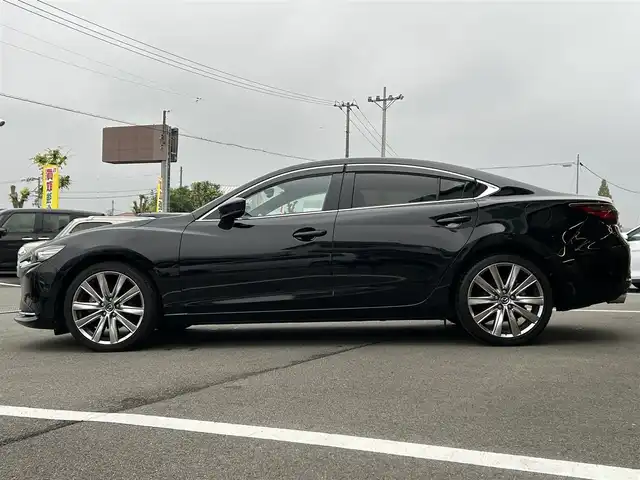 マツダ マツダ６セダン 25S Lパッケージ 愛媛県 2020(令2)年 3.5万km ジェットブラックマイカ 純正8型ナビ/全周囲カメラ/BOSEサウンドシステム＋11スピーカー/茶色レザーシート/全席シートヒーター/前席シートベンチレーション/前席パワーシート/運転席シートメモリー機能/ブラインドスポットモニター/追従機能付クルーズコントロール/ドライバーアテンションアラート/ヒル・ローンチ・アシスト/車線逸脱警報システム/AT誤発進抑制制御(前進/後退)/自動防眩ルームミラー/電動リアウインドウサンシェイド/本革巻ステアリング/ステアリングヒーター/電格ミラー/電動パーキングブレーキ/AutoHold機能/パドルシフト/現状サマー(純正ＡＷ)(235/40/R19)