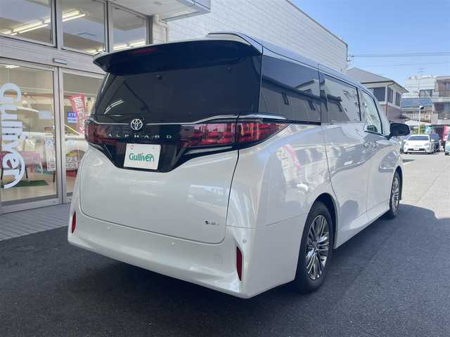 トヨタ アルファードハイブリット Z 愛知県 2025(令7)年 0.2万km プラチナホワイトパールマイカ ワンオーナー/左右独立パノラマルーフ＆電動シェード〈MOP〉/ユニバーサルステップ〈MOP〉/TOYOTAチームメイト〈MOP〉/・アドパンストパーク/・パーキングサポートブレーキ/・アドバンストドライブ/・フロントクロストラフィックアラート/・レーンチェンジアシスト/・ドライバーモニターカメラ/・パドルシフト/両側パワースライドドア/パワーバックドア/14インチディスプレイオーディオプラス/・車載ナビ／Bluetooth／HDMI/・地デジTV／Miracast/アラウンドビューカメラ/黒合皮シート/前席パワーシート/前席2列目シートヒーター＆ベンチレーション/2列目エグゼクティブパワーシート/デジタルインナーミラー/3眼LEDヘッドライト/フォグランプ/置くだけ充電/ビルトインETC2.0/TOYOTA Safety Sense/・プリクラッシュセーフティ/・レーントレーシングアシスト/・レーンディパーチャーアラート/・レーダークルーズコントロール/・アダプティブハイビーム/ブラインドスポットモニター/純正18インチAW
