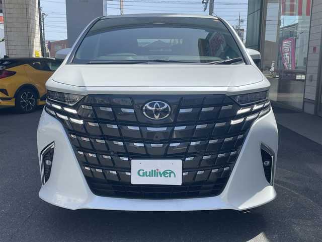 トヨタ アルファードハイブリット Z 愛知県 2025(令7)年 0.2万km プラチナホワイトパールマイカ ワンオーナー/左右独立パノラマルーフ＆電動シェード〈MOP〉/ユニバーサルステップ〈MOP〉/TOYOTAチームメイト〈MOP〉/・アドパンストパーク/・パーキングサポートブレーキ/・アドバンストドライブ/・フロントクロストラフィックアラート/・レーンチェンジアシスト/・ドライバーモニターカメラ/・パドルシフト/両側パワースライドドア/パワーバックドア/14インチディスプレイオーディオプラス/・車載ナビ／Bluetooth／HDMI/・地デジTV／Miracast/アラウンドビューカメラ/黒合皮シート/前席パワーシート/前席2列目シートヒーター＆ベンチレーション/2列目エグゼクティブパワーシート/デジタルインナーミラー/3眼LEDヘッドライト/フォグランプ/置くだけ充電/ビルトインETC2.0/TOYOTA Safety Sense/・プリクラッシュセーフティ/・レーントレーシングアシスト/・レーンディパーチャーアラート/・レーダークルーズコントロール/・アダプティブハイビーム/ブラインドスポットモニター/純正18インチAW