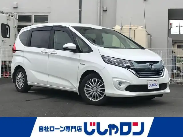 ホンダ フリード ハイブリット G ホンダセンシング 栃木県 2019(令1)年 14万km ホワイトオーキッドパール 株)IDOMが運営する【じしゃロン小山店】の自社ローン専用車両になります。こちらは現金またはオートローンご利用時の価格です。自社ローンご希望の方は別途その旨お申付け下さい//純正フルセグナビ/（CD/DVD/AM/FMラジオ）/(Bluetooth)/スマートキー/プッシュスタート/バックカメラ/クルーズコントロール/衝突軽減システム/レーンキープアシスト/ＥＴＣ/ステアリングリモコン/電動格納ドアミラー/パワーウインドウ/防眩ミラー/オートライト