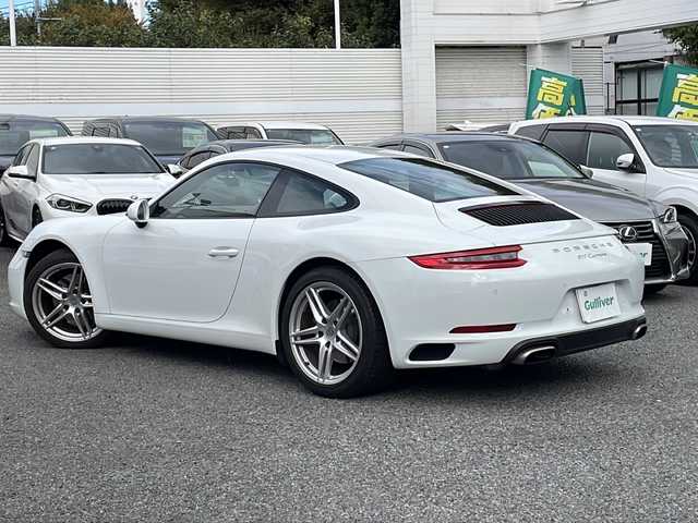 ポルシェ ９１１ カレラ 東京都 2017(平29)年 1.8万km ピュアホワイト 新車時保証書　整備記録簿/取扱説明書/ポルシェアクティブセーフ/アダプティブクルーズコントロール/アイドリングストップ/純正ナビ/BT/USB/SD/バックカメラ　ETC【DSRC】/ドライブレコーダー【前後】/レザーシート/シートヒーター/フロント背もたれパワーシート/アクティブサスペンション【PASM】/キーレスキー×２/LEDヘッドライト/オートライト/パドルシフト付皮巻きハンドル/純正19インチアルミ