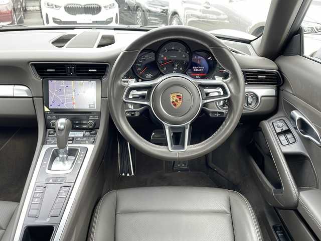 ポルシェ ９１１ カレラ 東京都 2017(平29)年 1.8万km ピュアホワイト 新車時保証書　整備記録簿/取扱説明書/ポルシェアクティブセーフ/アダプティブクルーズコントロール/アイドリングストップ/純正ナビ/BT/USB/SD/バックカメラ　ETC【DSRC】/ドライブレコーダー【前後】/レザーシート/シートヒーター/フロント背もたれパワーシート/アクティブサスペンション【PASM】/キーレスキー×２/LEDヘッドライト/オートライト/パドルシフト付皮巻きハンドル/純正19インチアルミ