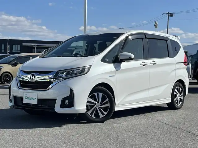 ホンダ フリード ハイブリット EX 奈良県 2017(平29)年 6.8万km ホワイトオーキッドパール 純正ナビ（VXM-174VFXi）/（フルセグ/BT/CD/DVD)/レーダークルーズコントロール/バックカメラ/衝突軽減システム/レーンキープアシスト/両側パワースライドドア/ハーフレザーシート/前席シートヒーター/後席サンシェード/オートライト/前後ドライブレコーダー/ETC/純正15インチＡＷ/取り扱い説明書/スペアキーＸ１