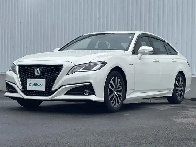 トヨタ クラウン ハイブリッド S Cパッケージ 愛媛県 2019(平31)年 9.5万km ホワイトパールクリスタルシャイン 純正ナビ（Bluetooth/フルセグTV/メモリナビ）/USB/ETC/バックカメラ/AUX接続可能/純正フロアマット/パワーシート/シートヒーター/ステアリングヒーター/バドルシフト/純正アルミホイール/前後コーナーセンサー/クルーズコントロール/LEDヘッドライト/ABS/横滑り防止装置/レーンキープアシスト/盗難防止装置/オートマチックハイビーム/衝突被害軽減システム