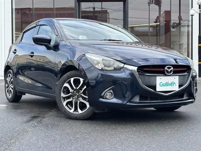 マツダ デミオ XD ツーリング 宮城県 2015(平27)年 4.8万km ディープクリスタルブルーマイカ 登録時走行距離４７６７０ｋｍ/クルーズコントロール/ブラインドスポットモニター/ヘッドアップディスプレイ/純正ナビ/・Bluetooth/バックカメラ/衝突被害軽減ブレーキ/レーンキープアシスト/横滑り防止機能/オートライト/プッシュスタート/スマートキー/ＥＴＣ/純正アルミホイール/純正フロアマット/フォグランプ/LEDヘッドライト/ウインカーミラー/電格ミラー/ドアバイザー