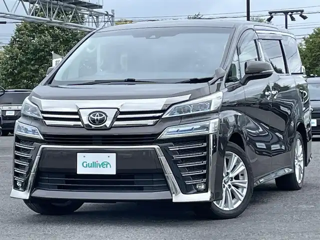 トヨタ ヴェルファイア Z 道央・札幌 2020(令2)年 6.6万km グラファイトM ４WD/寒冷地仕様/純正ディスプレイオーディオ/AM/FM/BT/フルセグ/トヨタセーフティセンス/プリクラッシュセーフティ/横滑り防止装置/レーダークルーズコントロール/レーンキープアシスト/クリアランスソナー/パーキングサポートブレーキ/ロードサインアシスト/バックカメラ/ビルトインETC/ドライブレコーダー/アイドリングストップ/ECOMODE/ワイパーデアイサー/ワイパーデアイサー/両側パワースライドドア/２列目オットマン/レザー調シートカバー/革巻きステアリング/ステアリングリモコン/電動パーキング/ブレーキホールド/MTモード付AT/プッシュスタート/スマートキー/LEDヘッドライト/オートライト/オートハイビーム/フォグランプ/電動格納ミラー/ウィンカーミラー/純正フロアマット/ドアバイザー