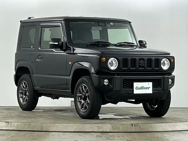 スズキ ジムニー XC 愛知県 2022(令4)年 1.6万km ブルーイッシュブラックパール3 ４WD/ターボ/9インチフローリングナビ/（AM/FM/フルセグTV/Bluetooth/CD/DVD）/スズキセーフティサポート/・衝突軽減ブレーキ/・レーンキープアシスト/・オートマチックハイビーム/・誤発進抑制機能/クルーズコントロール/前後ドライブレコーダー/ETC/ダウンヒルアシスト/アイドリングストップ/純正16インチアルミホイール/LEDヘッドライト/オートライト/ヘッドライトウォッシャー/撥水ファブリックシート/背面タイヤ/シートカバー/横滑り防止機能/スマートキー/プッシュスタート/革巻きステアリング/ステアリングスイッチ