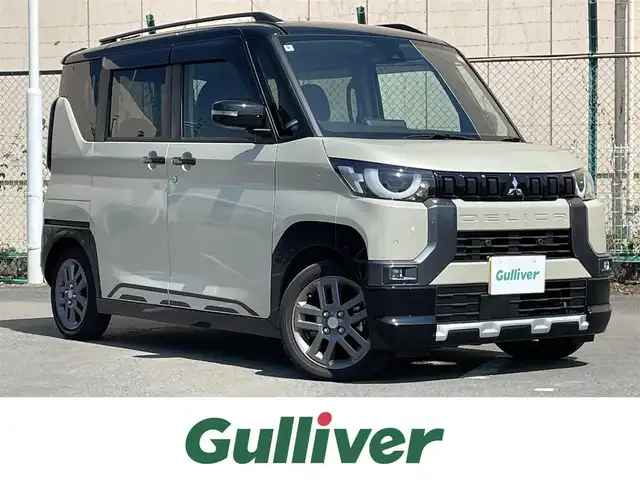 三菱 デリカミニ T プレミアム 東京都 2024(令6)年 0.4万km ナチュラルアイボリーメタリック ワンオーナー　/ＯＰツートンカラー　/純正９型ＤＡ　/全周囲カメラ　/ＥＴＣ　/マイパイロット　/デジタルインナーミラー　/両側電動　/シートヒーター　/ルーフレール　/ＯＰサイドデカール付き　/Ｂｌｕｅｔｏｏｔｈ