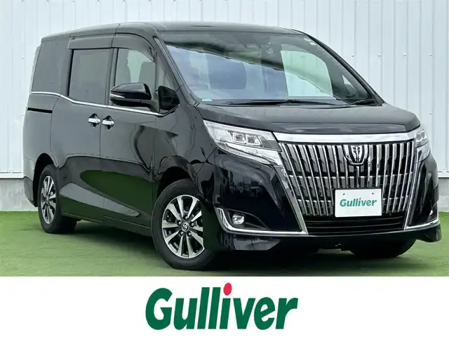 トヨタ エスクァイア Gi 香川県 2019(令1)年 3.9万km ブラック 純正10インチメモリーナビ（NSZN-Z68T）/→AM/FM/CD/DVD/Bluetooth/フルセグTV/フリップダウンモニター/バックカメラ/両側パワースライドドア/黒革シート/シートヒーター/ビルトイン2.0ETC/ウッドコンビステアリング/クルーズコントロール/衝突軽減ブレーキ/レーンキープアシスト/アイドリングストップ/LEDヘッドライト/オートハイビーム/前方ドライブレコーダー/コーナーセンサー/純正15インチアルミホイール/純正フロアマット/サンシェード/プッシュスタート/スマートキー