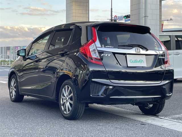 ホンダ フィット ハイブリット Lパッケージ 岡山県 2014(平26)年 9.1万km クリスタルブラックパール 登録時走行距離90957km/純正SDナビ/(AM/FM/DISC/TV/BT)/衝突被害軽減システム/クルーズコントロール/バックカメラ/ETC/ドライブレコーダー/チップアップシート/プッシュスタート/スマートキー/スペアキー/スターターキー/社外15インチアルミホイール/記録簿/保証書/取扱説明書