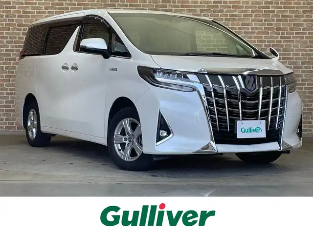 トヨタ アルファードハイブリット X 岩手県 2019(令1)年 5.7万km ホワイトパールクリスタルシャイン ４WD/ツインムーンルーフ/ALPINE10.1型後席モニター/ALPINEビッグX９型ナビ/両側パワースライドドア/トヨタセーフティセンス/レーダークルーズコントロール/レーンアシスト/プリクラッシュセーフティ/オートマチックハイビーム/クリアランスソナー/横滑り防止装置/オートブレーキホールド/ステアリングスイッチ/バックカメラ/ETC/ドライブレコーダー/MTモード付きAT/LEDヘッドランプ/純正16インチアルミホイール