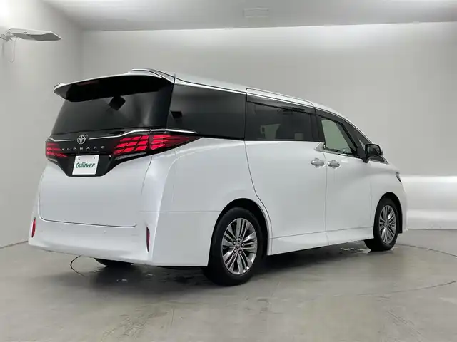 トヨタ アルファード Z 埼玉県 2023(令5)年 1.1万km プラチナホワイトパールマイカ ガラスルーフ　ユニバーサルステップ　純正１４インチディスプレイオーディオ　フリップダウンモニター　パノラミックビューモニター　セーフティセンス　ミラー型前後ドラレコ　ワイヤレス充電　メモリシート　シートヒーター　ベンチレーション　両側パワースライドドア  スマートキー　オートライト　純正アルミホイール　LEDヘッドライト 地デジフルセグＴＶ