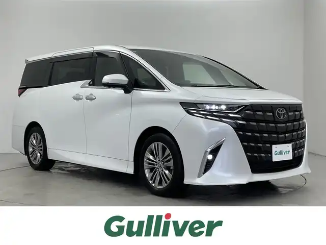 トヨタ アルファード Z 埼玉県 2023(令5)年 1.1万km プラチナホワイトパールマイカ ガラスルーフ　ユニバーサルステップ　純正１４インチディスプレイオーディオ　フリップダウンモニター　パノラミックビューモニター　セーフティセンス　ミラー型前後ドラレコ　ワイヤレス充電　メモリシート　シートヒーター　ベンチレーション　両側パワースライドドア  スマートキー　オートライト　純正アルミホイール　LEDヘッドライト 地デジフルセグＴＶ