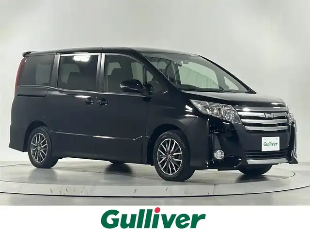 トヨタ ノア Si 佐賀県 2014(平26)年 7.5万km ブラック 社外アルパイン製10インチナビ【EX1000】/【フルセグTV.CD.DVD.Bluetooth】/バックカメラ/オートライト/LEDヘッドライト/フォグライト/両側パワースライドドア/前後ドライブレコーダー/ビルトインETC/ウォークスルー/後席サンシェード/純正フロアマット/革巻きステアリング/ステアリングスイッチ/純正16インチアルミホイール/プッシュスタート/アイドリングストップ/スペアキー×１