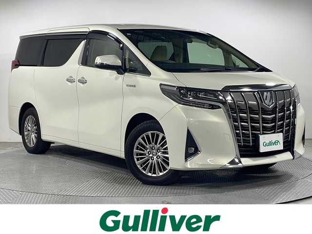 トヨタ アルファードハイブリット G 広島県 2019(令1)年 3.5万km ラグジュアリーホワイトパールクリスタルシャインガラスフレーク 白革シート/JBLプレミアムサウンド/パノラミックビューモニター/ALPINE12.8型フリップダウンモニター/純正9型ナビ（フルセグTV/Bluetooth）/3眼LEDヘッドランプ/デジタルインナーミラー/パワーバックドア/パワーシート/ポジションメモリー/シートヒーター/ベンチレーション/セーフティセンス/・プリクラッシュセーフティ/・レーントレーシングアシスト/・アダプティブハイビーム/・レーダークルーズコントロール/クリアランスソナー/ブラインドスポットモニター/ETC2.0/ドライブレコーダー/USB入力端子